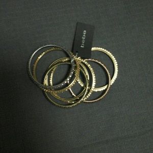 BEBÉ SNAKE STYLE AND RHINESTONE BRACELETS .